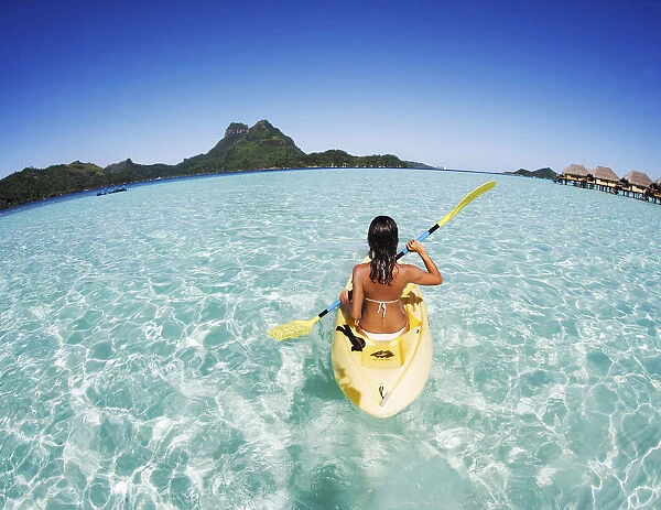 French Polynesia, Bora Bora, Female Kayaker Enjoying A Day On The Water