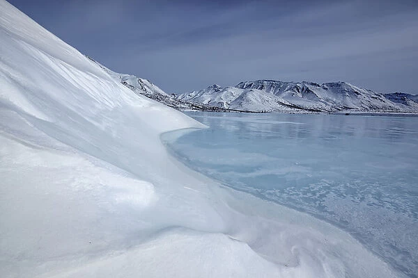 The frozen klondike river along the dempster highway in tombstone territorial park; yukon canada