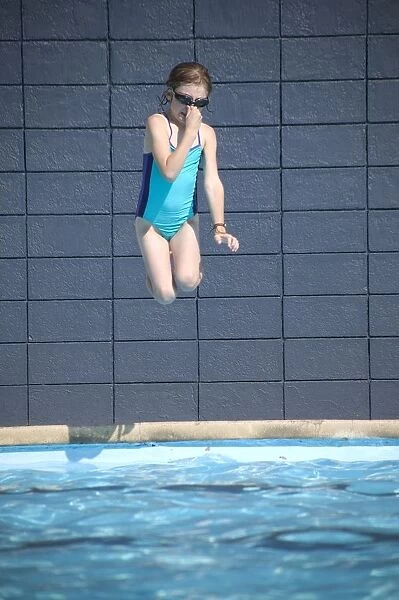 Girl Jumps Into The Pool
