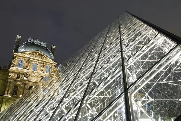 The Glass Pyramid And The Louvre At Dusk