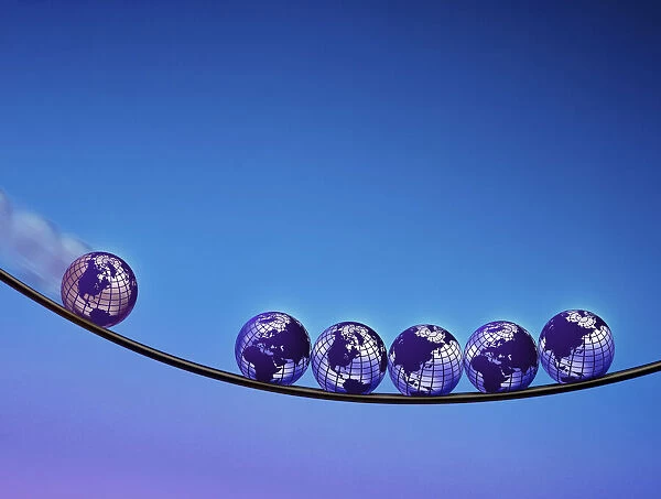 Globes Balancing on Wire