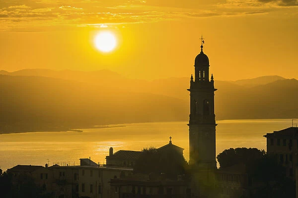 Golden Sky At Dusk With Tower Of Church; San Lorenzo Della Costa, Liguria, Italy