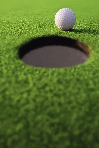 Golf Ball On Lip Of Cup