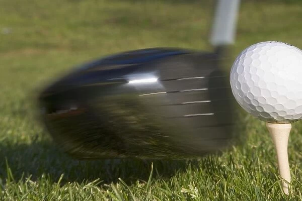Golf Ball On Tee Hit By Driver