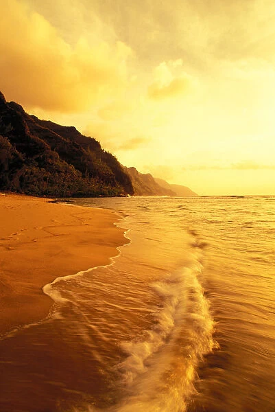 Hawaii, Kauai, Na Pali Coast, Beach At Sunset, With Foamy Surf And Cliff In Background