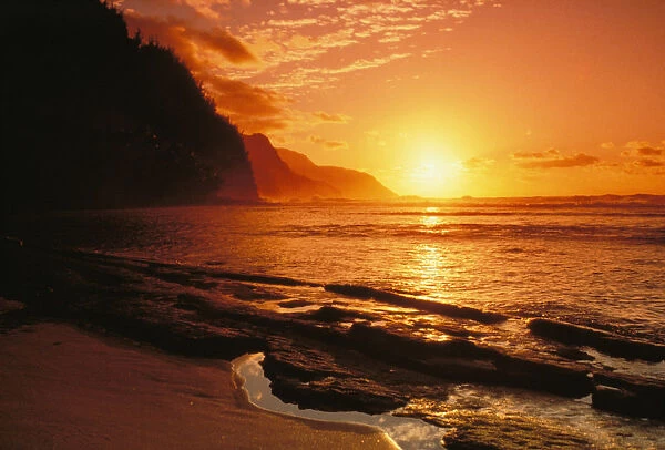 Hawaii, Kauai, Napali Coast At Sunset, Bright Orange Sky And Calm Ocean