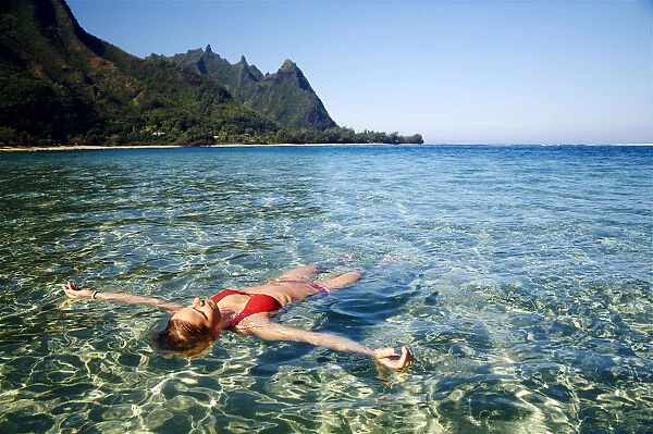 Hawaii, Kauai, Tunnels Beach, Woman Floats In The Ocean