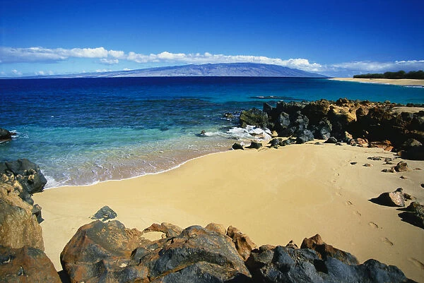Hawaii, Lanai, Polihua Beach; Footprints In Sand, Rocks Around Beach, Molokai In Distance