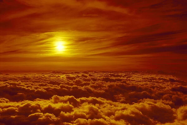 Hawaii, Maui, Haleakala National Park Sunset Orange Wispy Clouds Surround Sun Puffy Layer Thick Clouds
