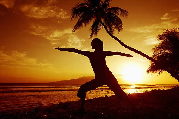 Hawaii, Maui, Olowalu, Woman Doing Yoga By The Ocean At Sunset Under Palm Tree