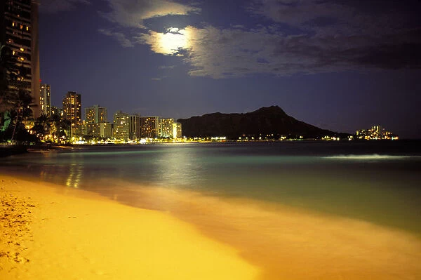 Hawaii, Oahu, Diamond Head At Night, Moon Hidden Behind Clouds, Bright Yellow Sand Skyline Illuminated