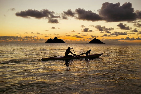 Hawaii, Oahu, Lanikai, Man And Dog On A One-Man Outrigger Canoe At Sunset