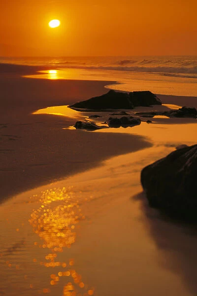 Hawaii, Oahu, North Shore, Beautiful Orange Sunset On Rocky Shoreline, Reflections