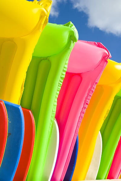 Hawaii, Oahu, Waikiki, Close-Up View Of Colorful Plastic Rafts And Boogie Boards