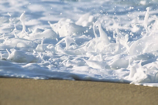 Hawaii, Ripple Of Water And Seafoam Breaks On Sandy Shore