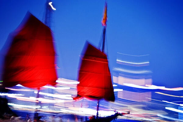 Hong Kong, Tsim Sha Tsui K, A Red Sailed Chinese Junk Boat Passes In Front Of Hong Kong Island