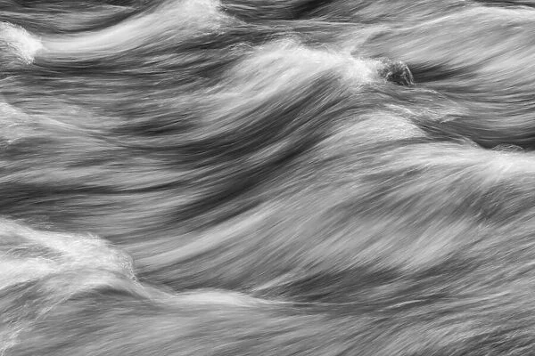 Image of water flowing in a long exposure in the Klondike River