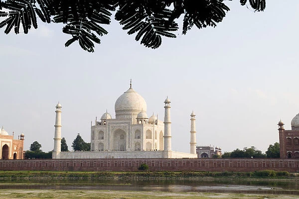 India, Temple burial site seen from Yamuna River at sunset; Agra, Taj Mahal
