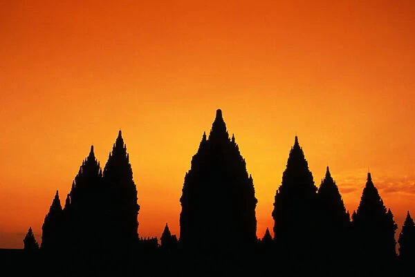 Indonesia, Java, Prambanan, Shiva Mahadeva Temple Silhouetted At Sunset