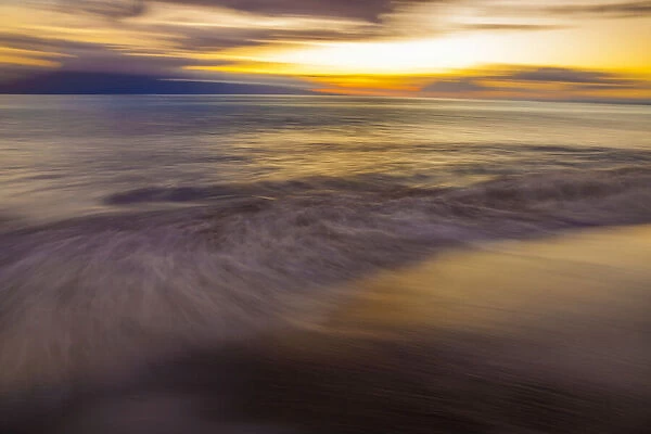 An intentionally  /  artistically blurred sunset from the island of Maui, Hawaii, USA; Maui, Hawaii, United States of America