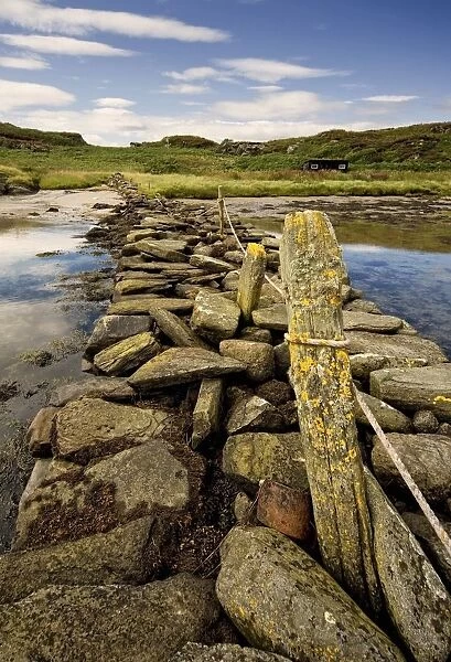 Isle Of Gigha, Scotland; Rocky Shoreline And Wharf