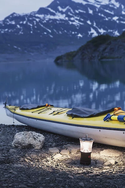 Kayak And Lantern On The Beach With Mountains In The Back Ground At Dusk, Shoup Bay State Marine Park, Prince William Sound, Valdez, Southcentral Alaska