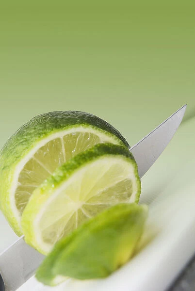 A Knife Cutting A Lime