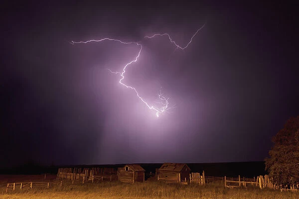 Lightning bolt over some abandoned buildings near val marie; Saskatchewan canada