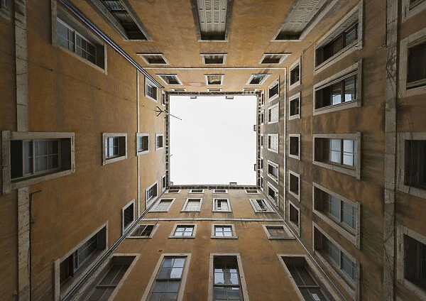 Low Angle View To The Sky From Inside The Four Walls Of A Building; Venice, Veneto, Italy