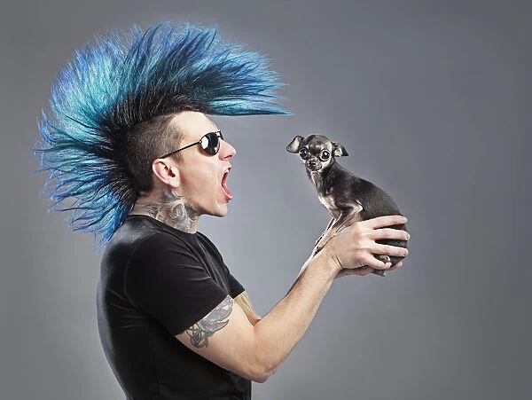 A Man With A Blue Mohawk Yells At His Dog
