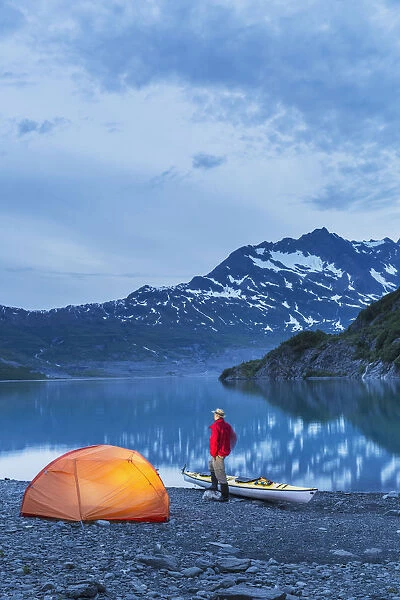 Man Camping With A Tent And Kayak At Shoup Bay State Marine Park, Prince William Sound, Valdez, Southcentral Alaska