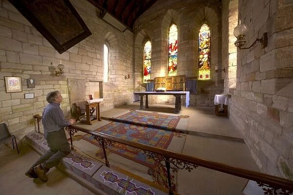 Man Praying In Chapel, Holy Island, Bewick, England