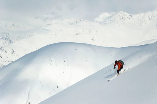 Man Skiing The West Face Of Peak 3720, Turnagain Arm, Chugach Mountains, Southcentral Alaska