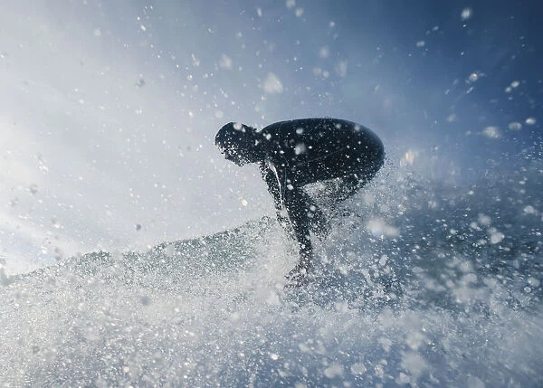 A Man Surfing Off Bunker Beach; Tarifa, Cadiz, Andalusia, Spain