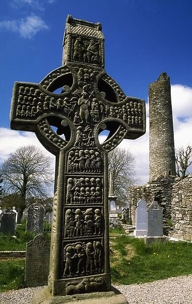 Monasterboice, Co Louth, Ireland; High Cross With Round Tower In The Distance