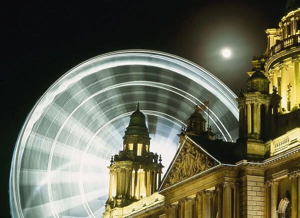 Moon Rising Behind Big Wheel And Belfast City Hall