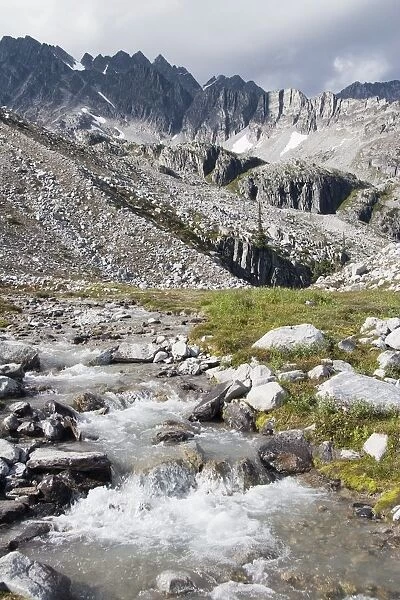 Mountain Stream And Mountains; British Columbia, Canada