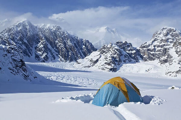 Mountain Tent On Ridge In Winter, Mt. Mckinley In Background, Part Of Mt. Dan Beard Immediately Behind Tent, Denali National Park And Preserve; Alaska, United States Of America