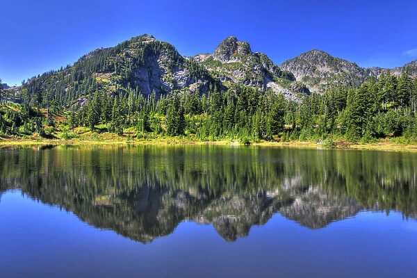Mountains reflected in a lake, Mount Baker National Recreation Area, Washington, USA