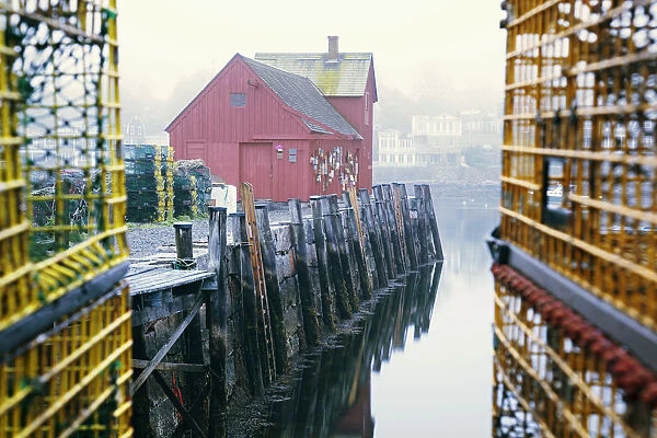 New England, Massachusetts, Red Building At The End Of Rockport Harbor, Framed By Trap Cages