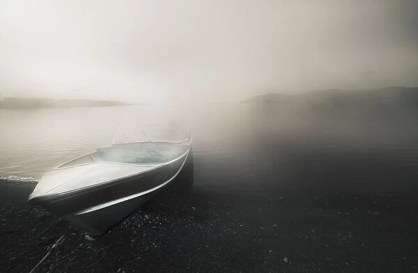 Northwest Territories, Canada; A Boat On The Shore Of The Arctic Ocean