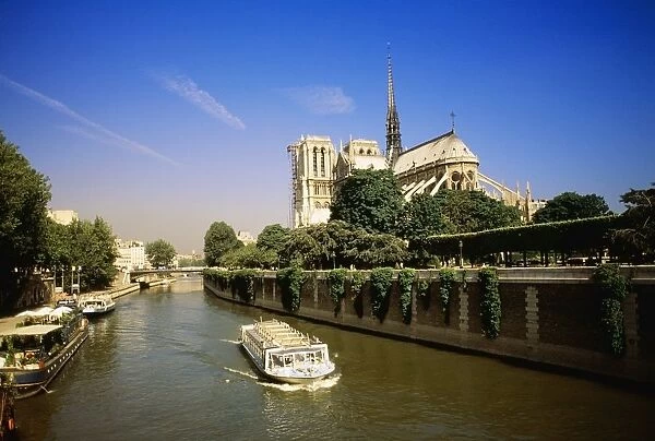 Notre Dame Cathedral And The Seine River, Paris, France, Europe