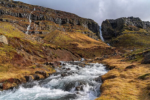 NA. Numerous waterfalls flow down the mounatins of Iceland as winter gives way to spring