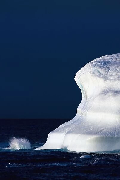 Ocean Water Splashing Against An Iceberg In The High Arctic Waters; Nunavut, Canada