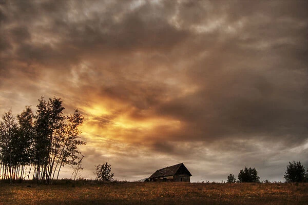 An Old Abandoned Homestead On A Hill During A Fall Sunset North Of Bon Accord, Alberta