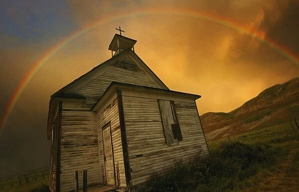 Old Church With Rainbow Over Building