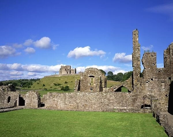 Old Ruins Of An Abbey With A Castle In The Background, Hore Abbey, Castle, County Tipperary, Republic Of Ireland