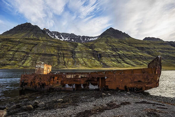 Old Shipwreck Along The Water In Mjoifjordur, East Iceland; Iceland