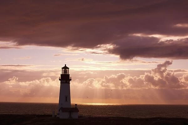 Oregon, United States Of America; Sunset Over Yaquina Head Lighthouse On The Oregon Coast