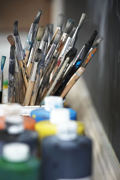 Paint Brushes And Paint Containers In A Classroom